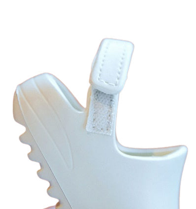 Side of light dusty green/gray shoe with velcro to close the shoe in the back, Jelly Bean Baby Co.