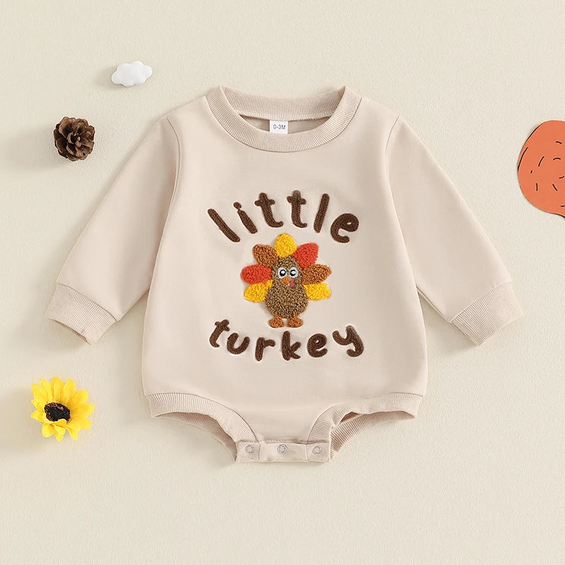 Beige "Little Turkey" Long Sleeved Onesie, baby girl, baby boy, baby boutique, Jelly Bean Baby Co., on a decorated background